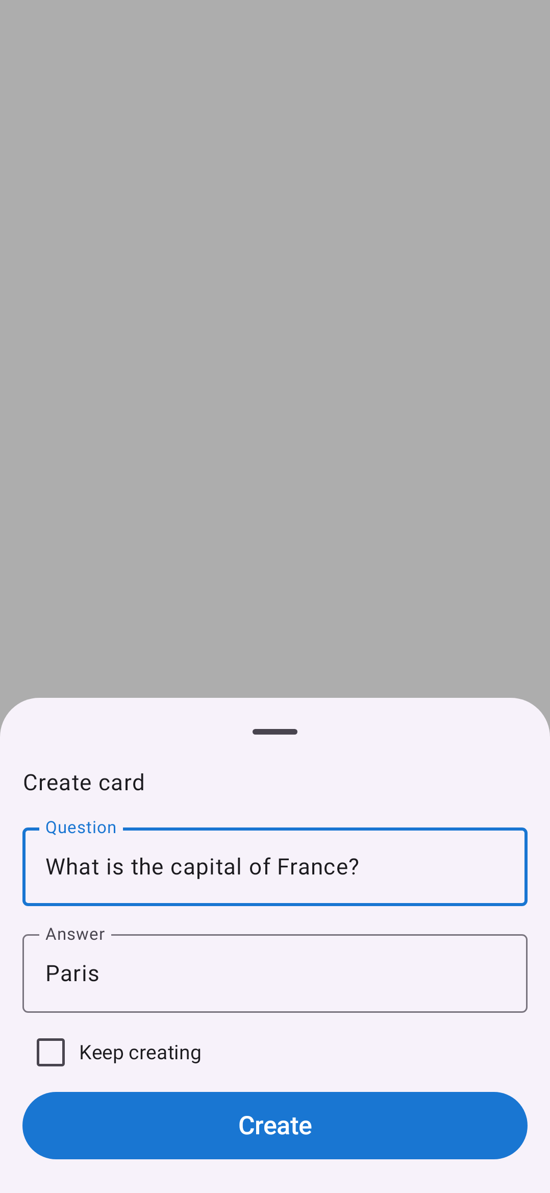 Peek Create card bottom sheet. Two text fields — Question filled with 'What is the capital of France?' and Answer filled with 'Paris' — a Keep creating checkbox, and a single blue Create button. The rest of the screen behind the sheet is dimmed.